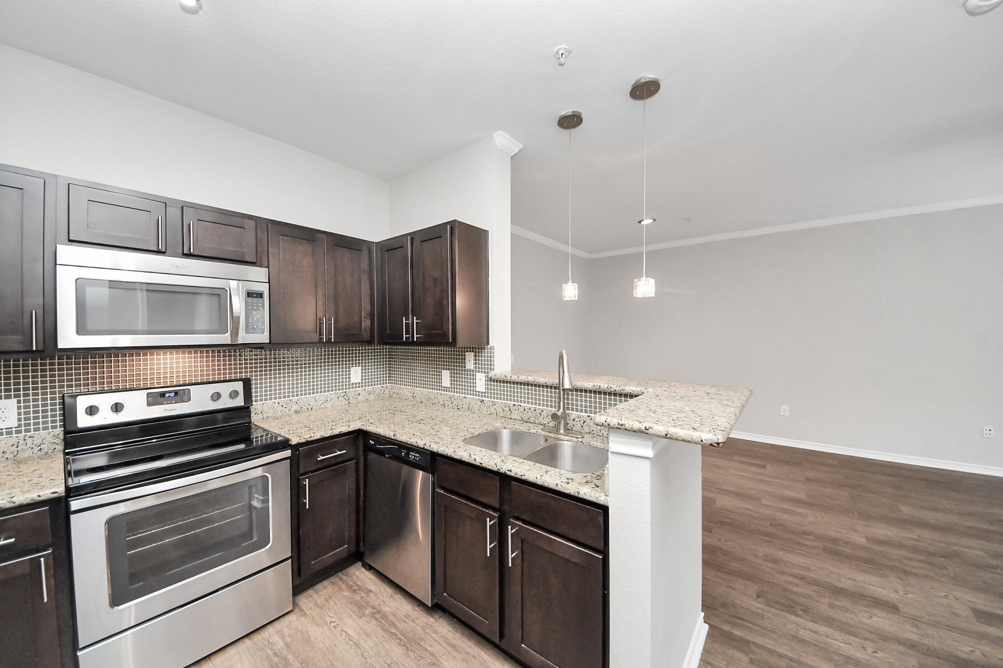 3003 Memorial Court, Unit 1139 Houston, TX 77007 - Photo 28 of 35 a kitchen with a sink cabinets and stainless steel appliances