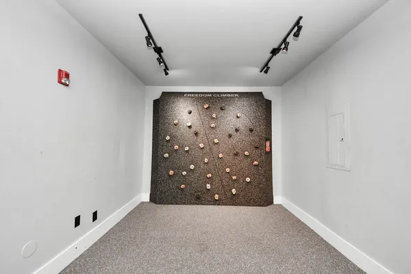 a kitchen with a refrigerator and a sink