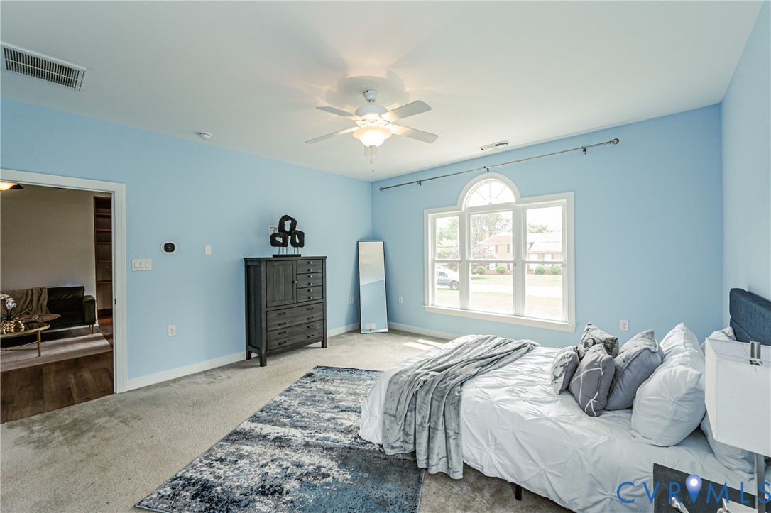 2018 Valentine Road Henrico, VA 23228 - Photo 39 of 65 a bedroom with a bed and a chandelier