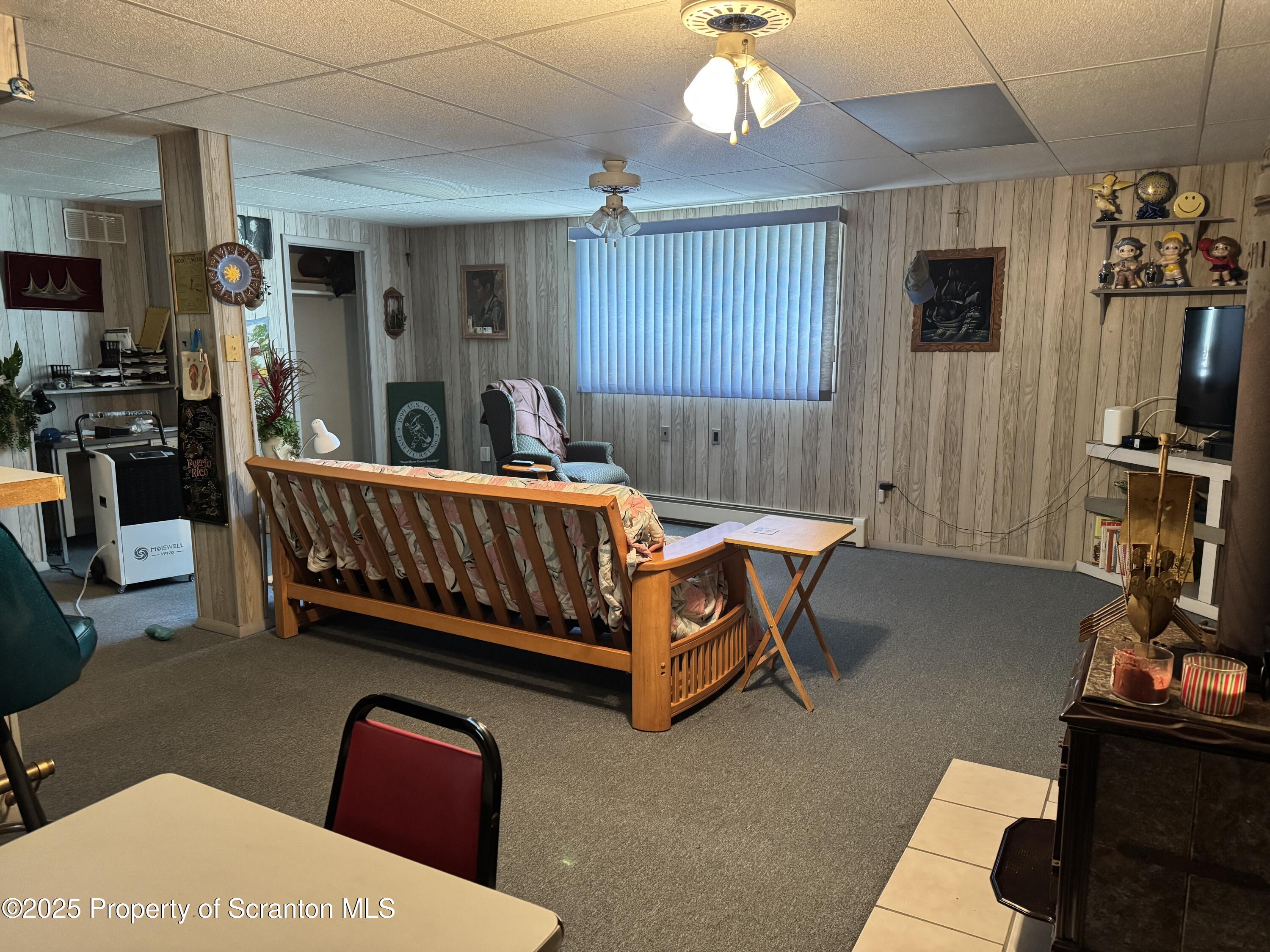 2356 Newton Ransom Boulevard Clarks Summit, PA 18411 - Photo 22 of 30 a bed room with furniture and a flat screen tv