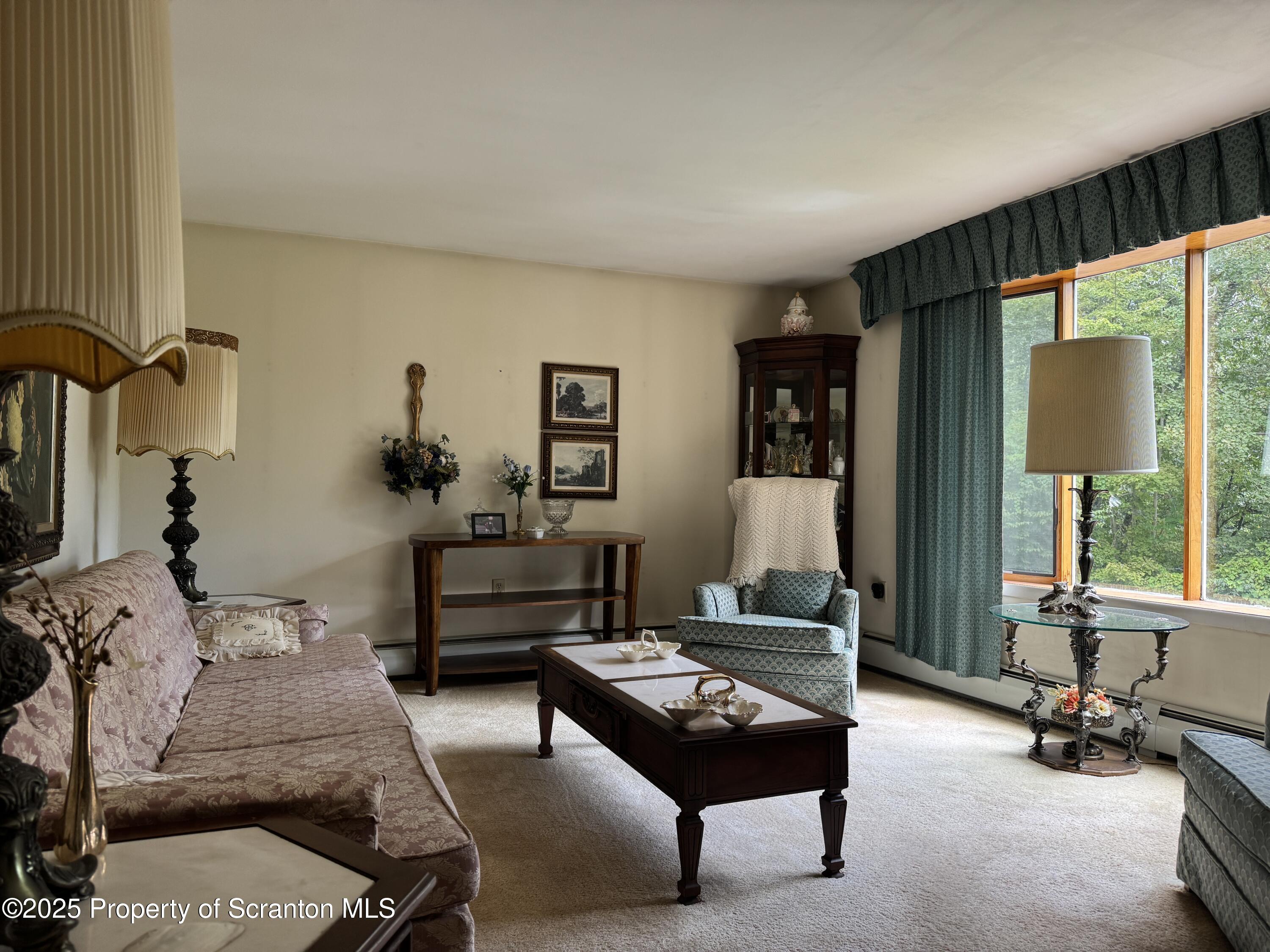 2356 Newton Ransom Boulevard Clarks Summit, PA 18411 - Photo 7 of 30 a bedroom with furniture and a large window