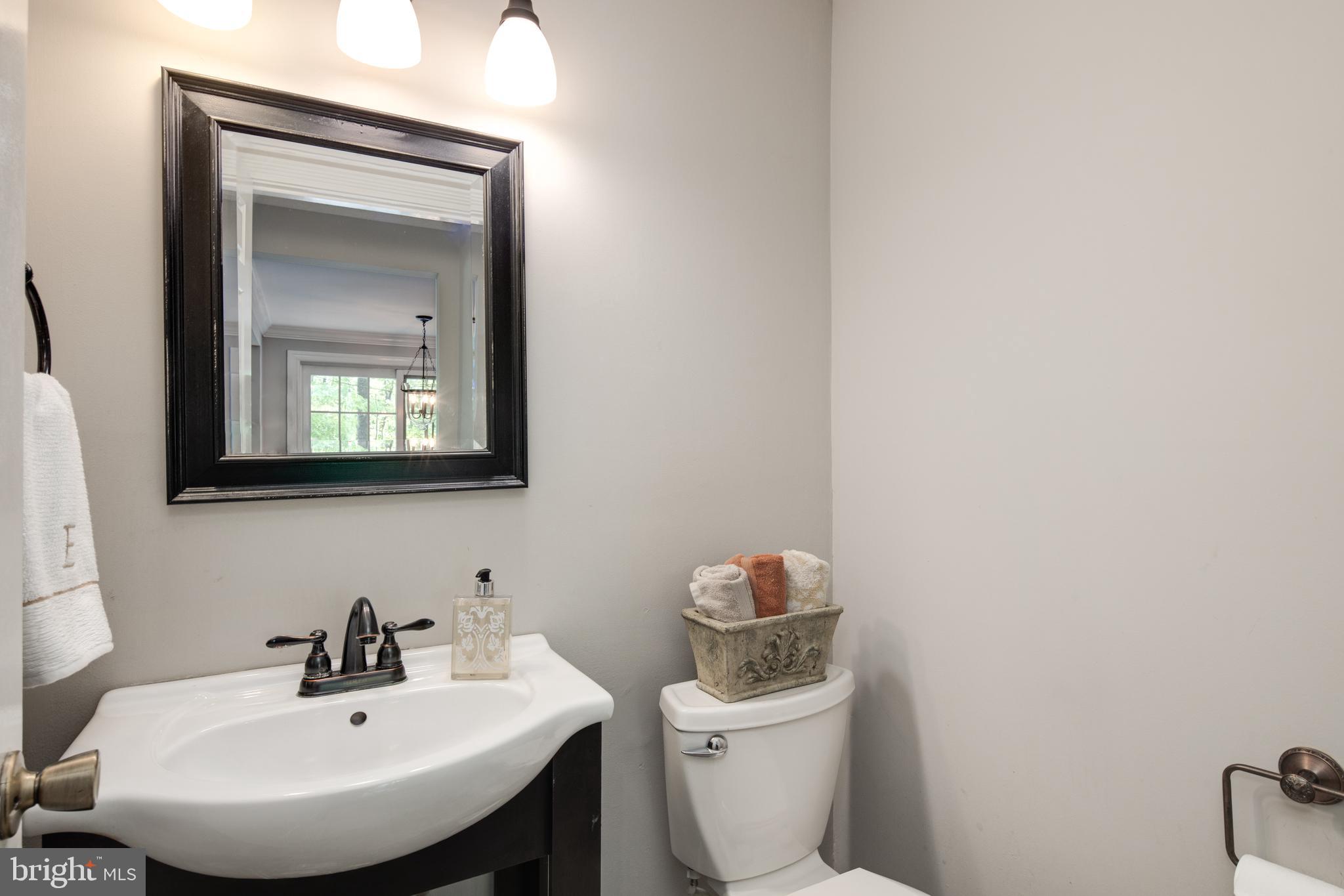 8325 Magic Leaf Road Springfield, VA 22153 - Photo 17 of 40 Half bath off of kitchen / entry from 2 car garage