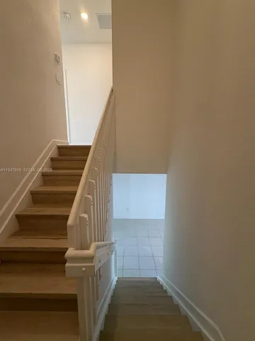 a view of entryway and kitchen