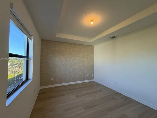 a bathroom with a sink a mirror and a window