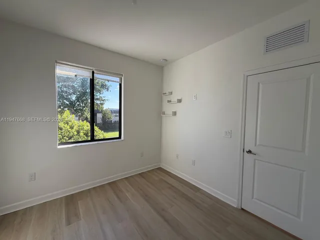 a view of an empty walk in closet
