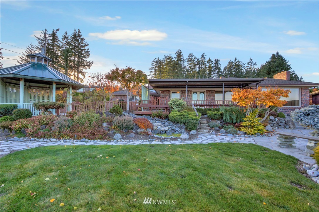 7002 Soundview Drive Gig Harbor, WA 98335 - Photo 1 of 33 a house view with a garden space
