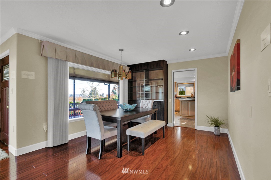 7002 Soundview Drive Gig Harbor, WA 98335 - Photo 12 of 33 a view of a dining room with furniture window and wooden floor
