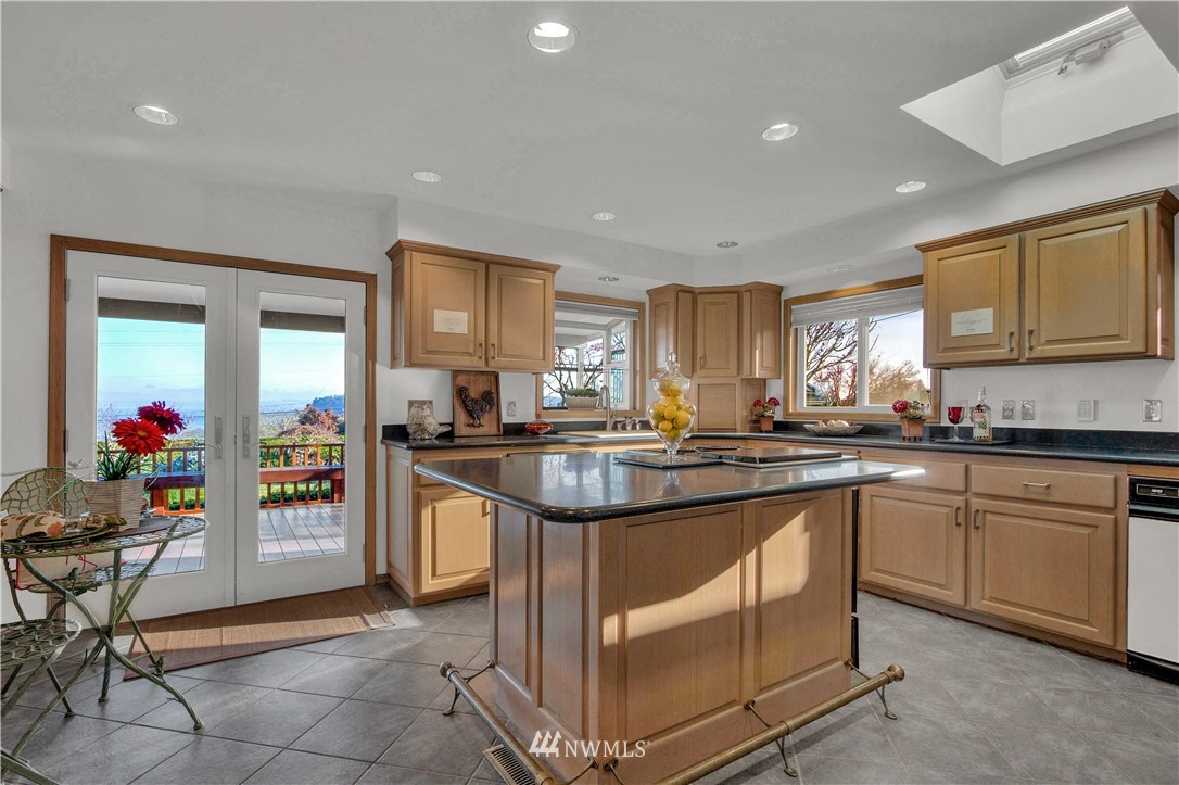 7002 Soundview Drive Gig Harbor, WA 98335 - Photo 14 of 33 a kitchen with stainless steel appliances granite countertop a stove and a sink