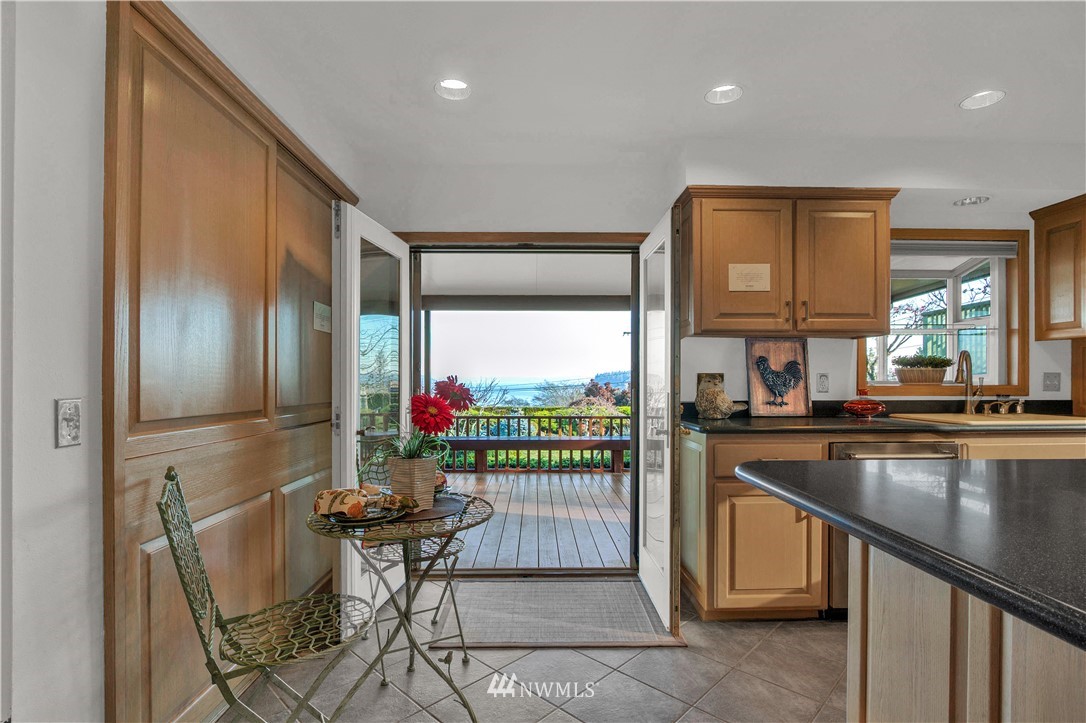 7002 Soundview Drive Gig Harbor, WA 98335 - Photo 15 of 33 a kitchen with stainless steel appliances granite countertop a refrigerator and a sink