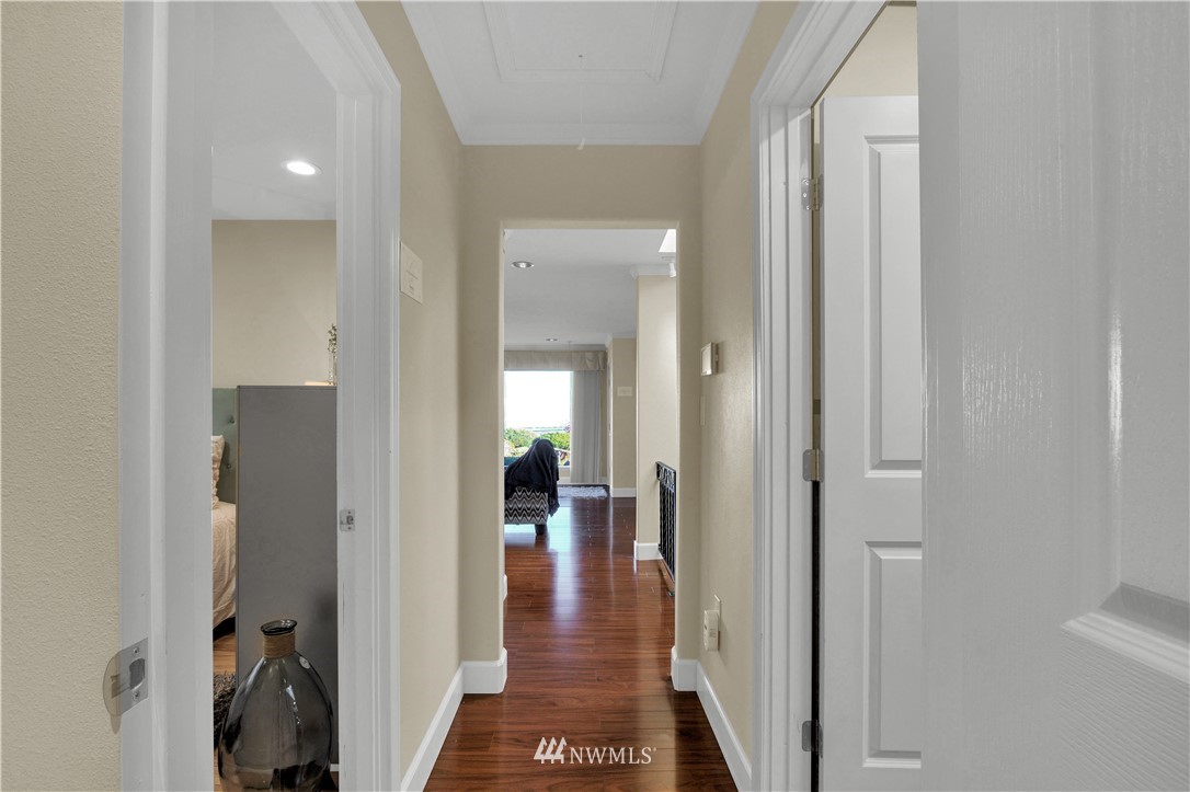7002 Soundview Drive Gig Harbor, WA 98335 - Photo 19 of 33 a view of a hallway with wooden floor