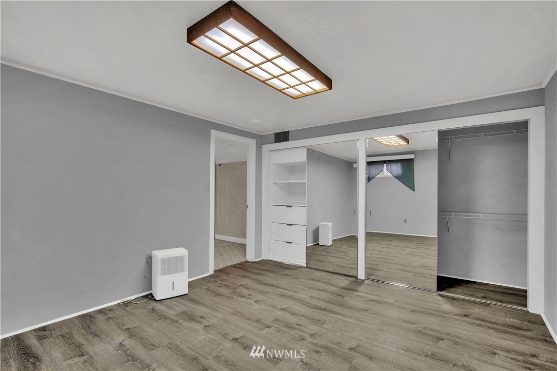 7002 Soundview Drive Gig Harbor, WA 98335 - Photo 28 of 33 a view of a room with wooden floor and white walls