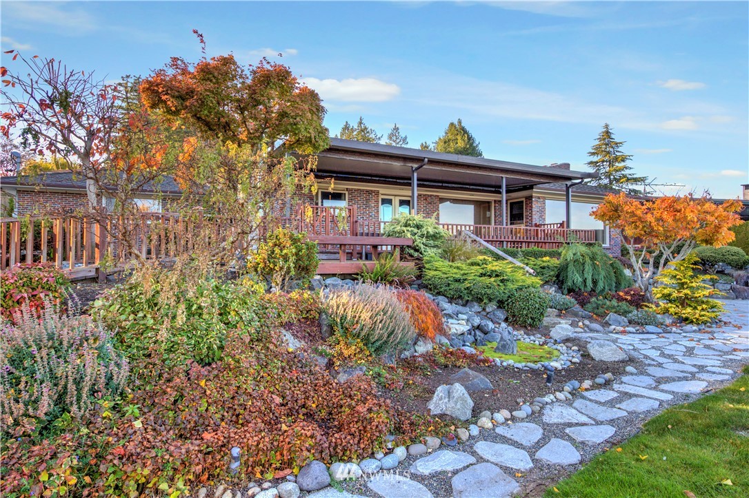 7002 Soundview Drive Gig Harbor, WA 98335 - Photo 5 of 33 a front view of a house with a yard