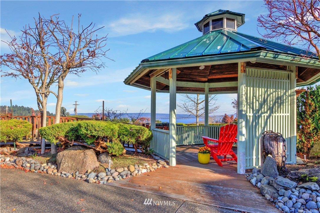 7002 Soundview Drive Gig Harbor, WA 98335 - Photo 6 of 33 a view of a porch with furniture and a yard