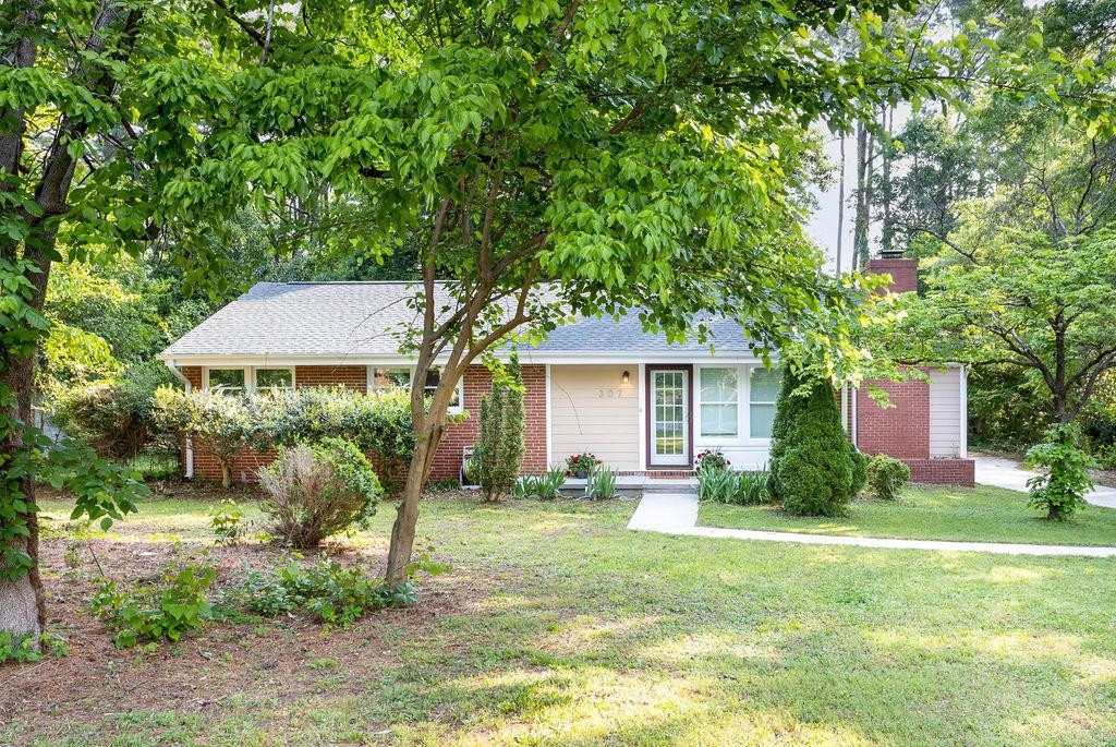 307 South King Charles Road Raleigh, NC 27610 - Photo 1 of 32 a front view of a house with garden