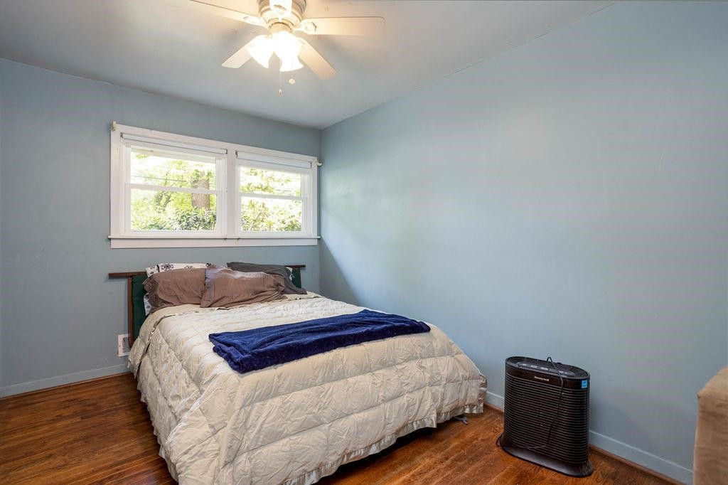 307 South King Charles Road Raleigh, NC 27610 - Photo 16 of 32 a bedroom with a bed and a window