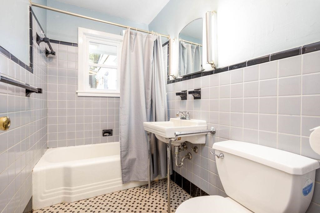 307 South King Charles Road Raleigh, NC 27610 - Photo 22 of 32 a bathroom with a sink toilet and shower