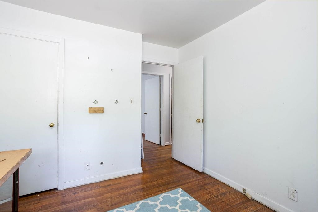 307 South King Charles Road Raleigh, NC 27610 - Photo 24 of 32 a view of an empty room with wooden floor