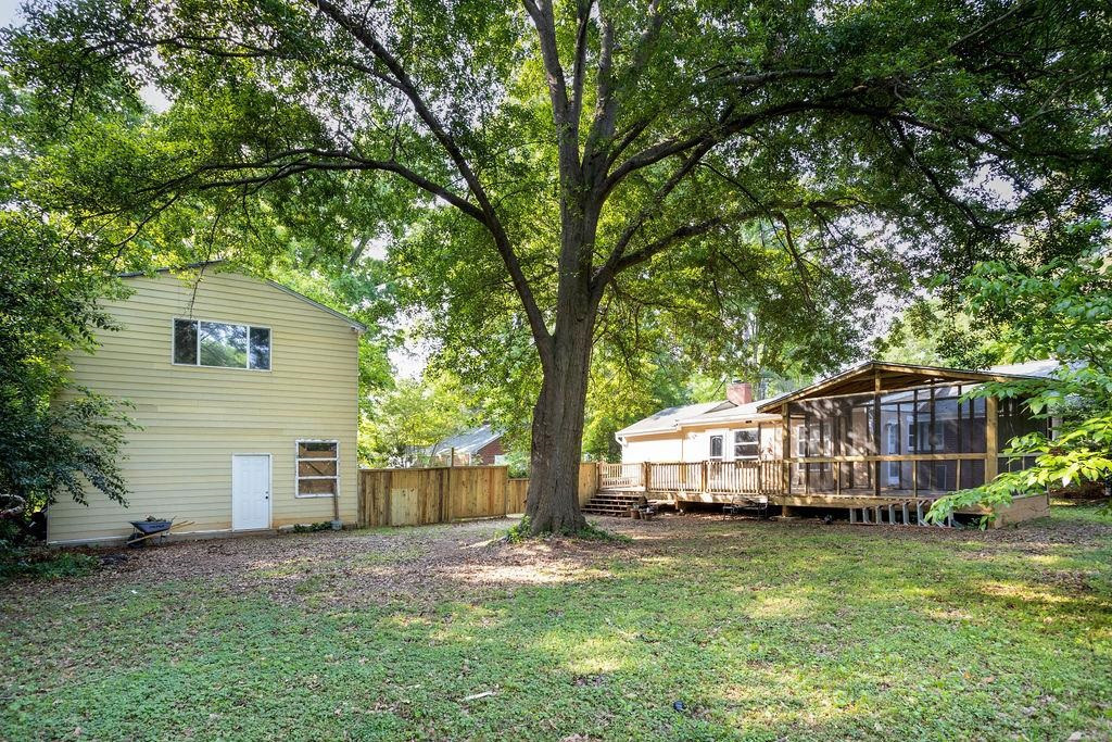 307 South King Charles Road Raleigh, NC 27610 - Photo 28 of 32 a view of a house with backyard and garden
