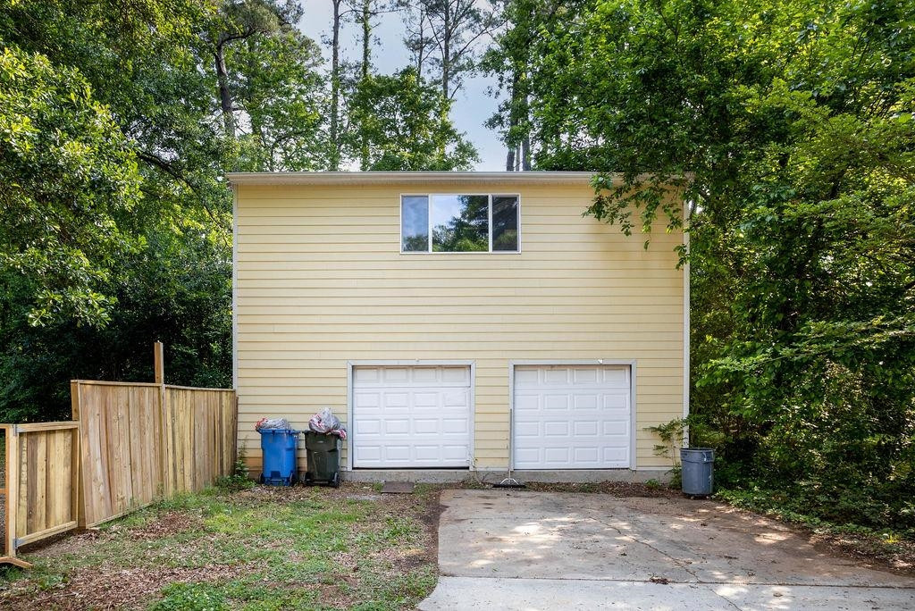 307 South King Charles Road Raleigh, NC 27610 - Photo 29 of 32 a view of a house with a yard and garage