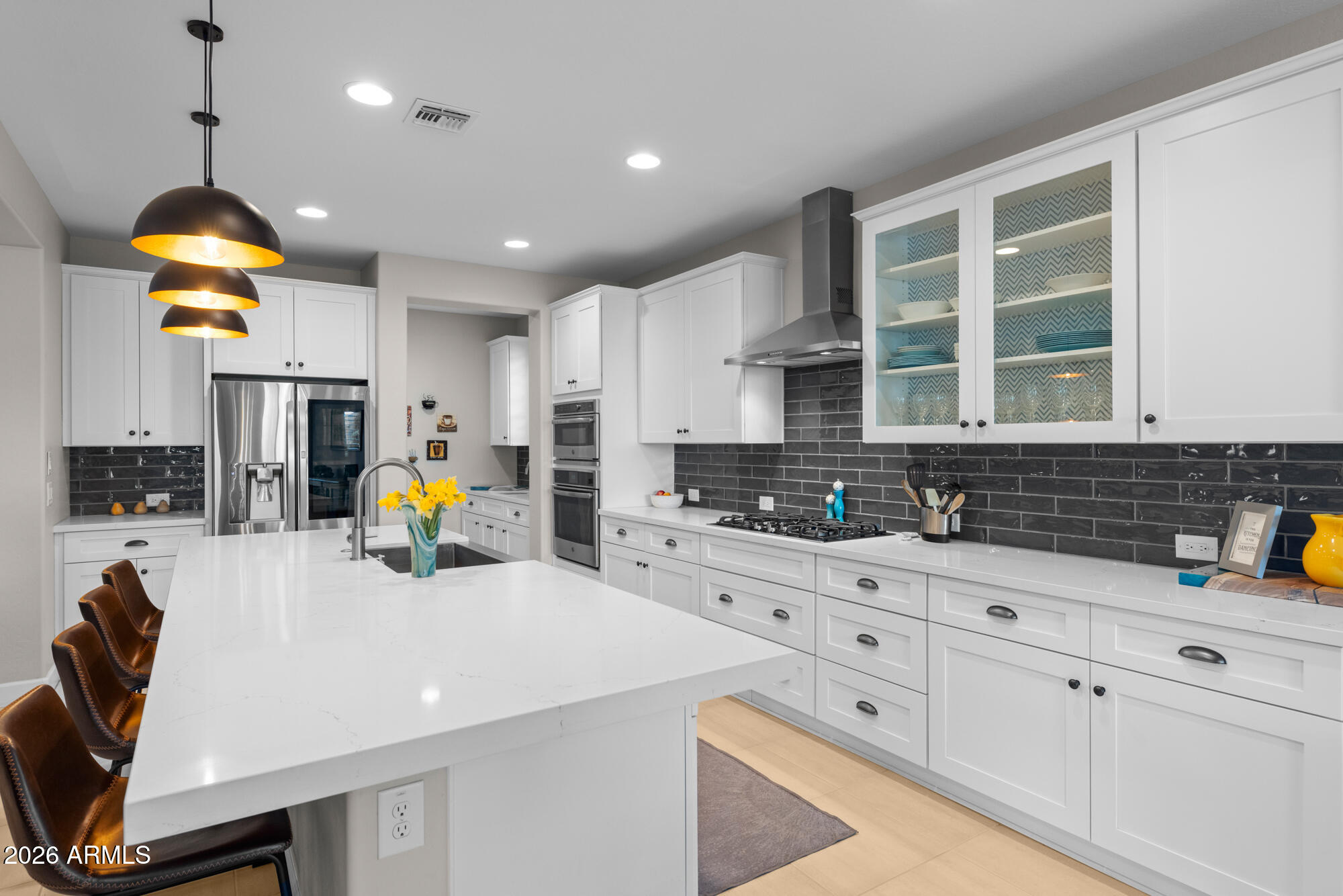 16705 Virginia Avenue Goodyear, AZ 85395 - Photo 13 of 56 a kitchen with a sink a stove and cabinets