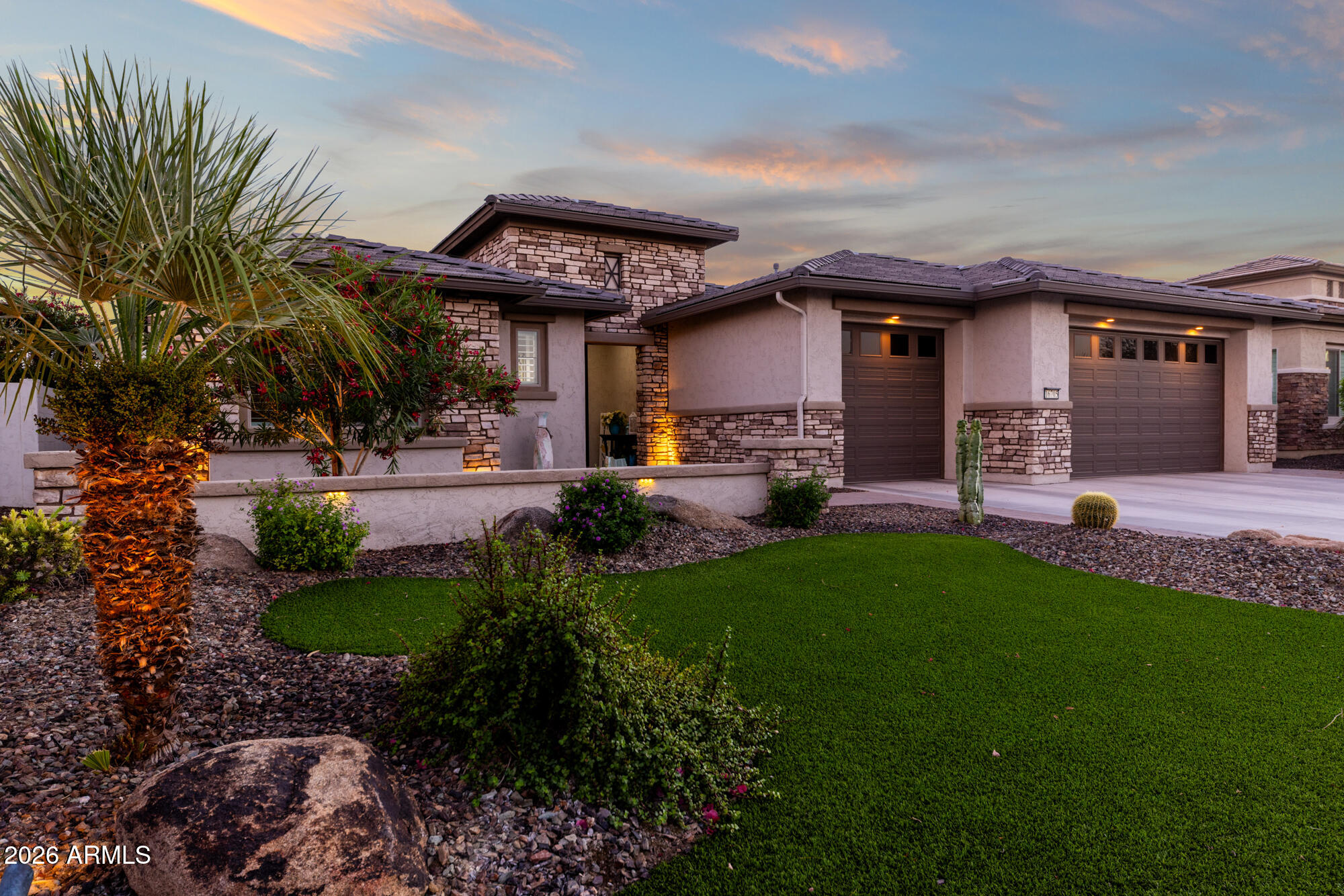 16705 Virginia Avenue Goodyear, AZ 85395 - Photo 2 of 56 a view of a house with a yard porch and sitting area