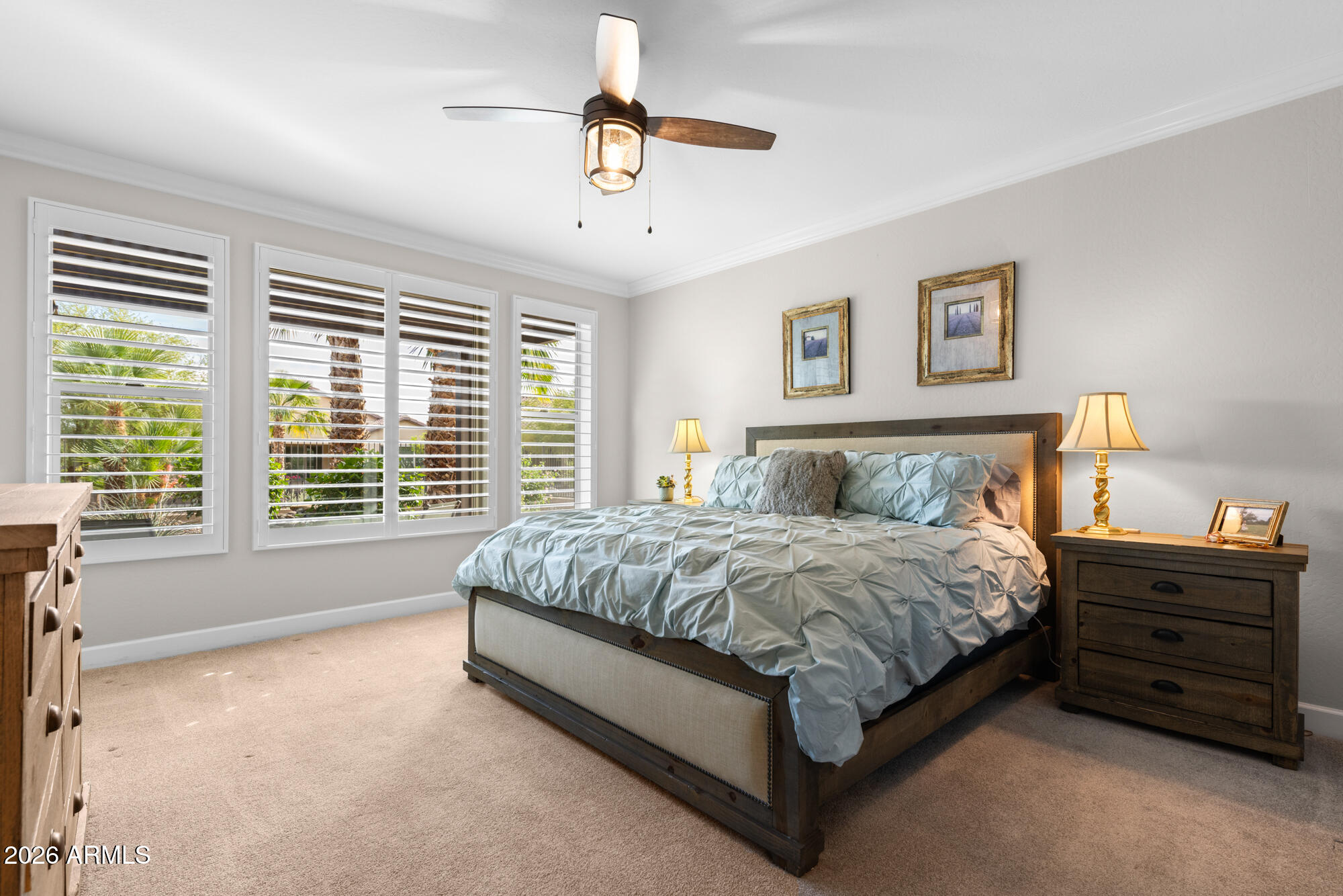 16705 Virginia Avenue Goodyear, AZ 85395 - Photo 23 of 56 a bed sitting in a bedroom next to a window