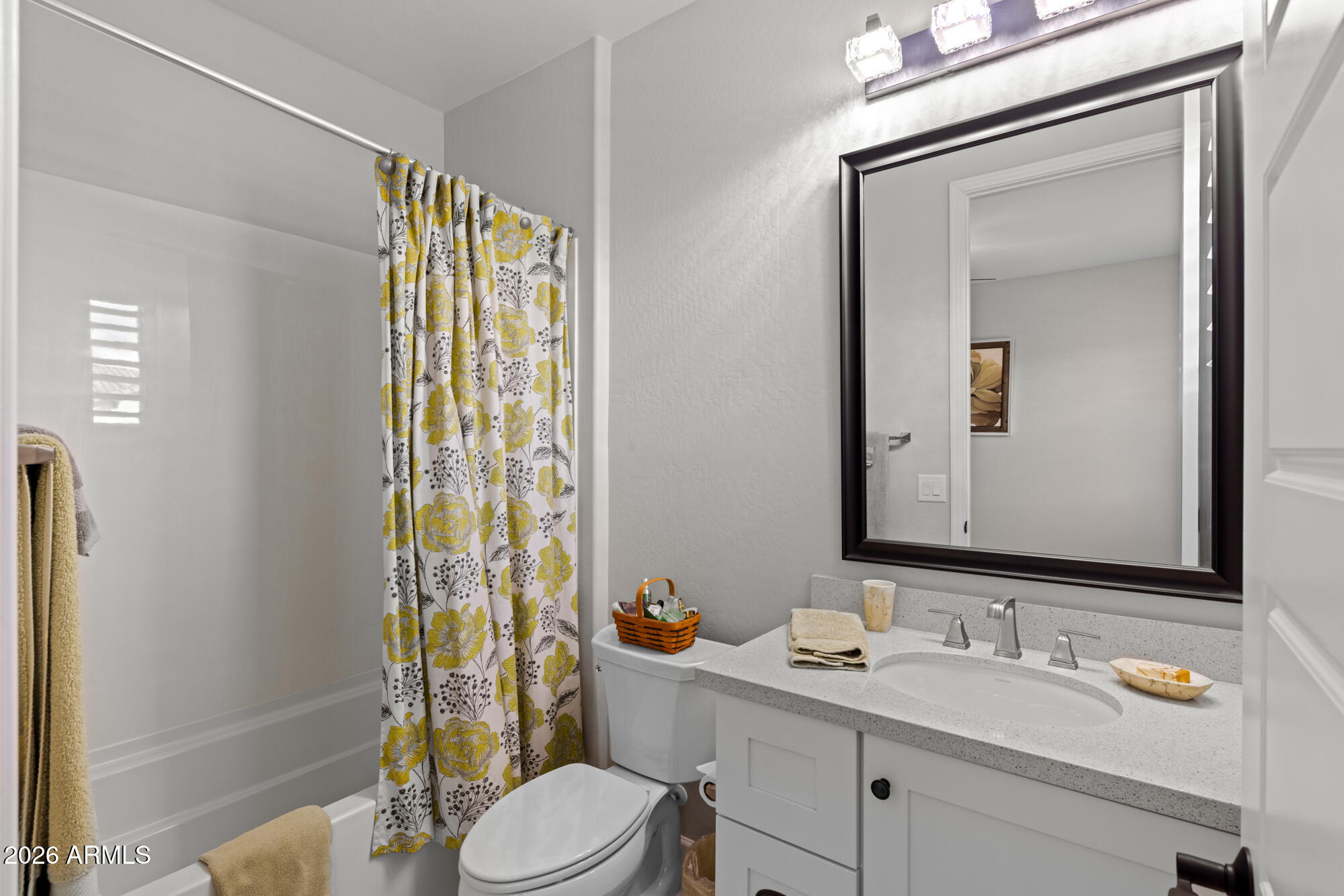 16705 Virginia Avenue Goodyear, AZ 85395 - Photo 27 of 56 a bathroom with a sink a toilet and shower