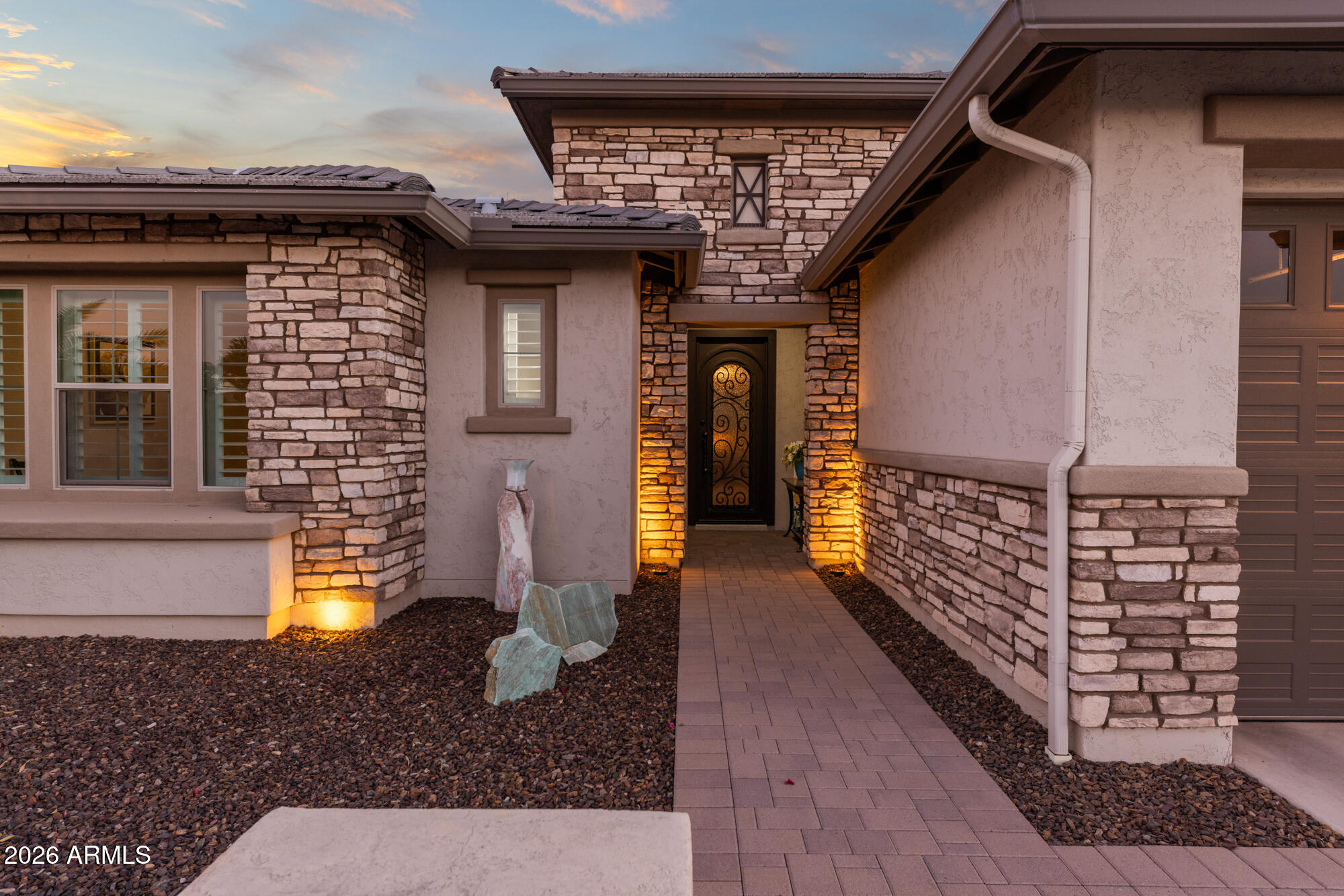 16705 Virginia Avenue Goodyear, AZ 85395 - Photo 3 of 56 a front view of a house with lots of lights