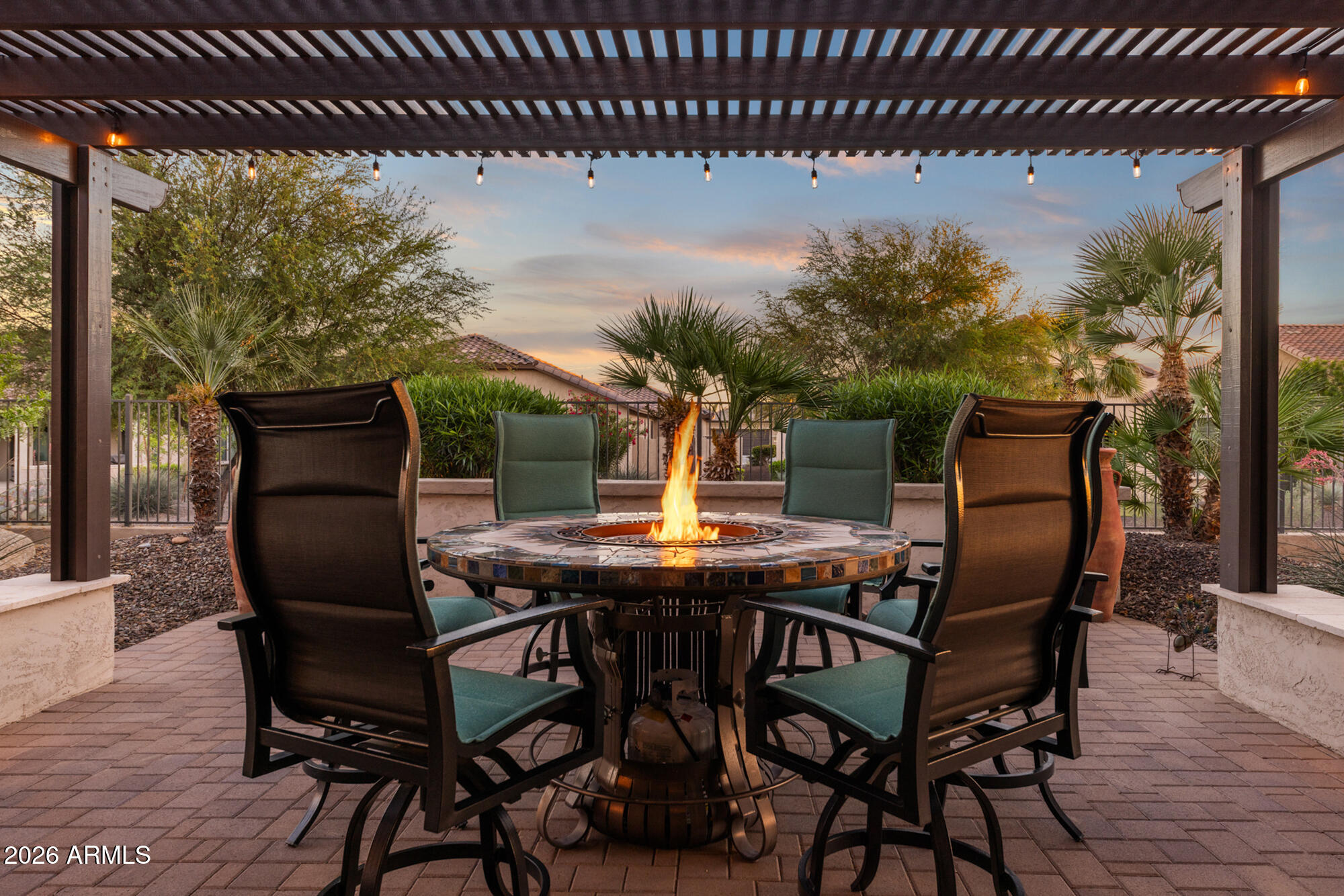 16705 Virginia Avenue Goodyear, AZ 85395 - Photo 38 of 56 a patio with table and chairs
