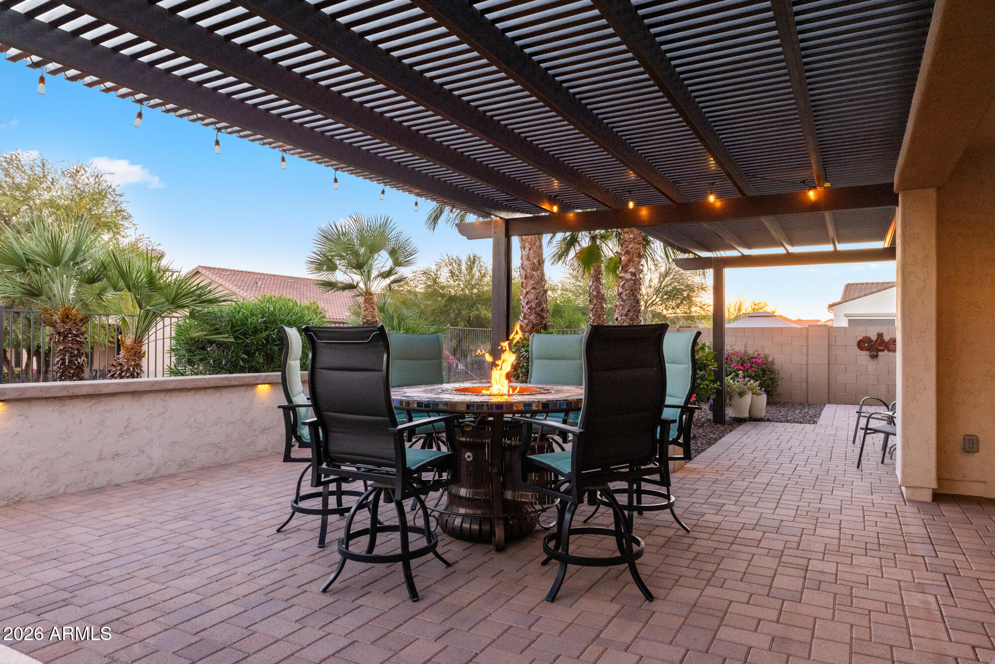 16705 Virginia Avenue Goodyear, AZ 85395 - Photo 40 of 56 a view of a patio with table and chairs and potted plants