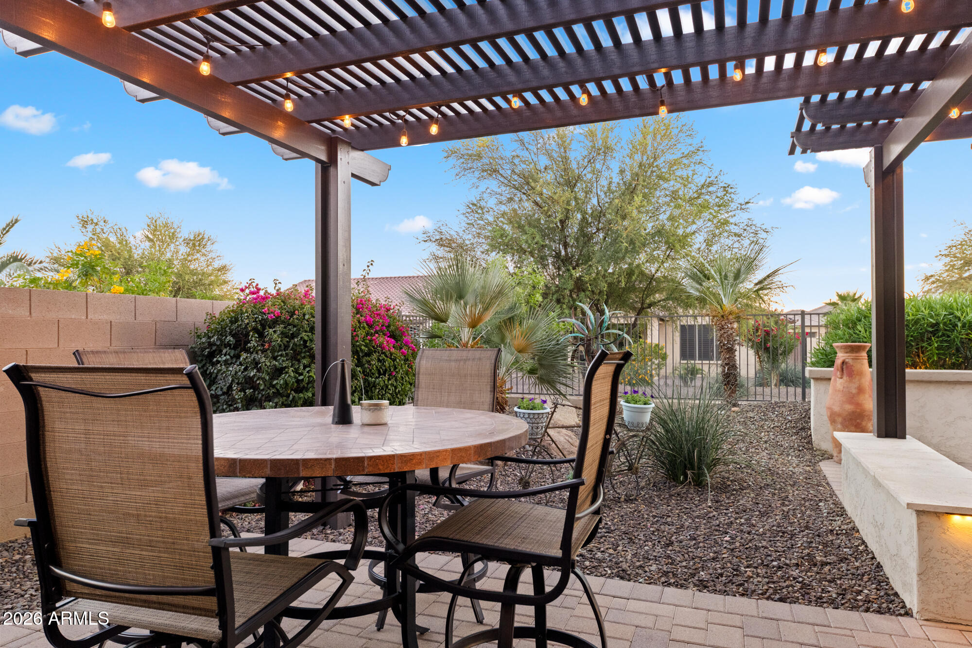 16705 Virginia Avenue Goodyear, AZ 85395 - Photo 41 of 56 a view of an outdoor dining space with a table and chairs