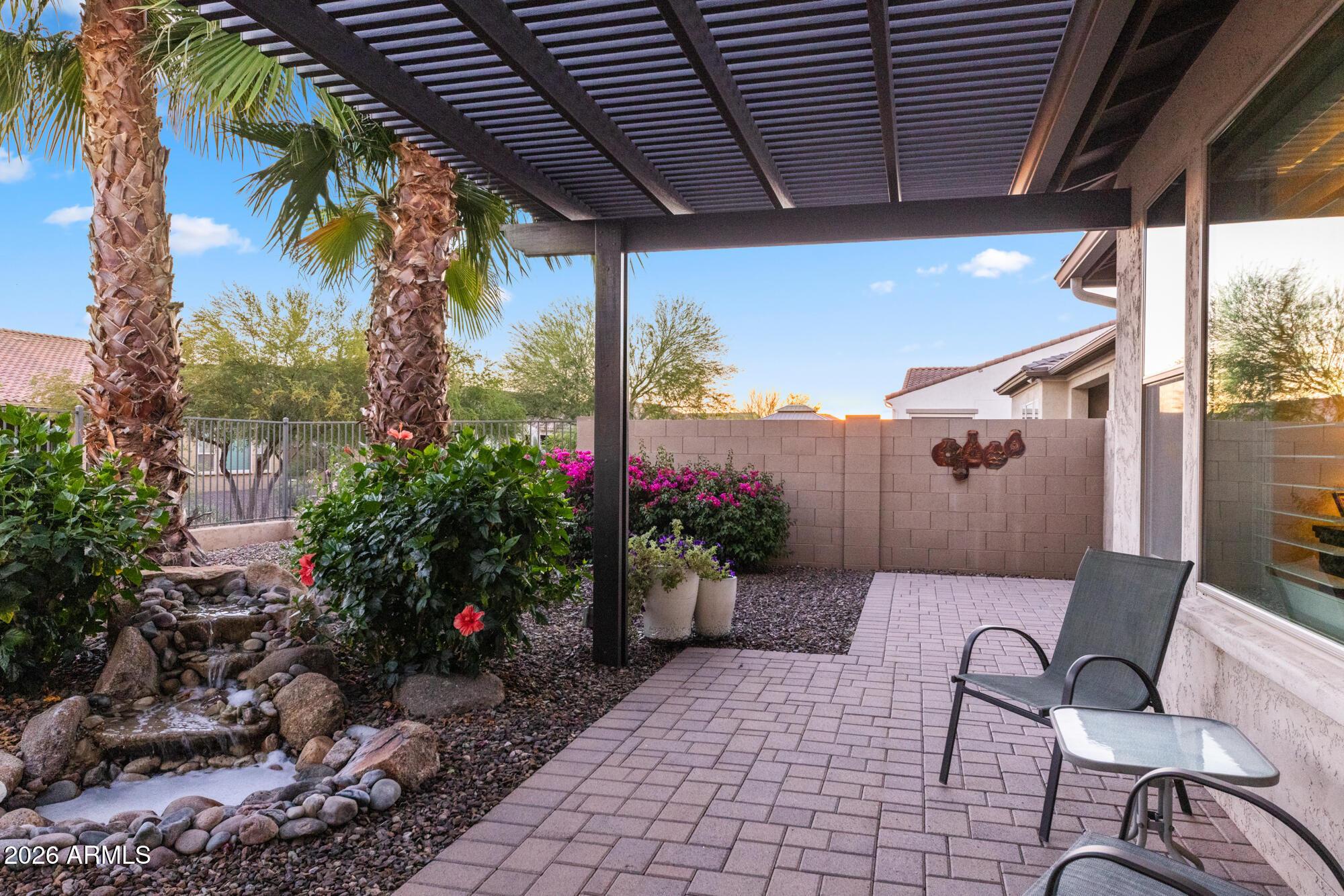 16705 Virginia Avenue Goodyear, AZ 85395 - Photo 44 of 56 a view of a chairs and table in the patio