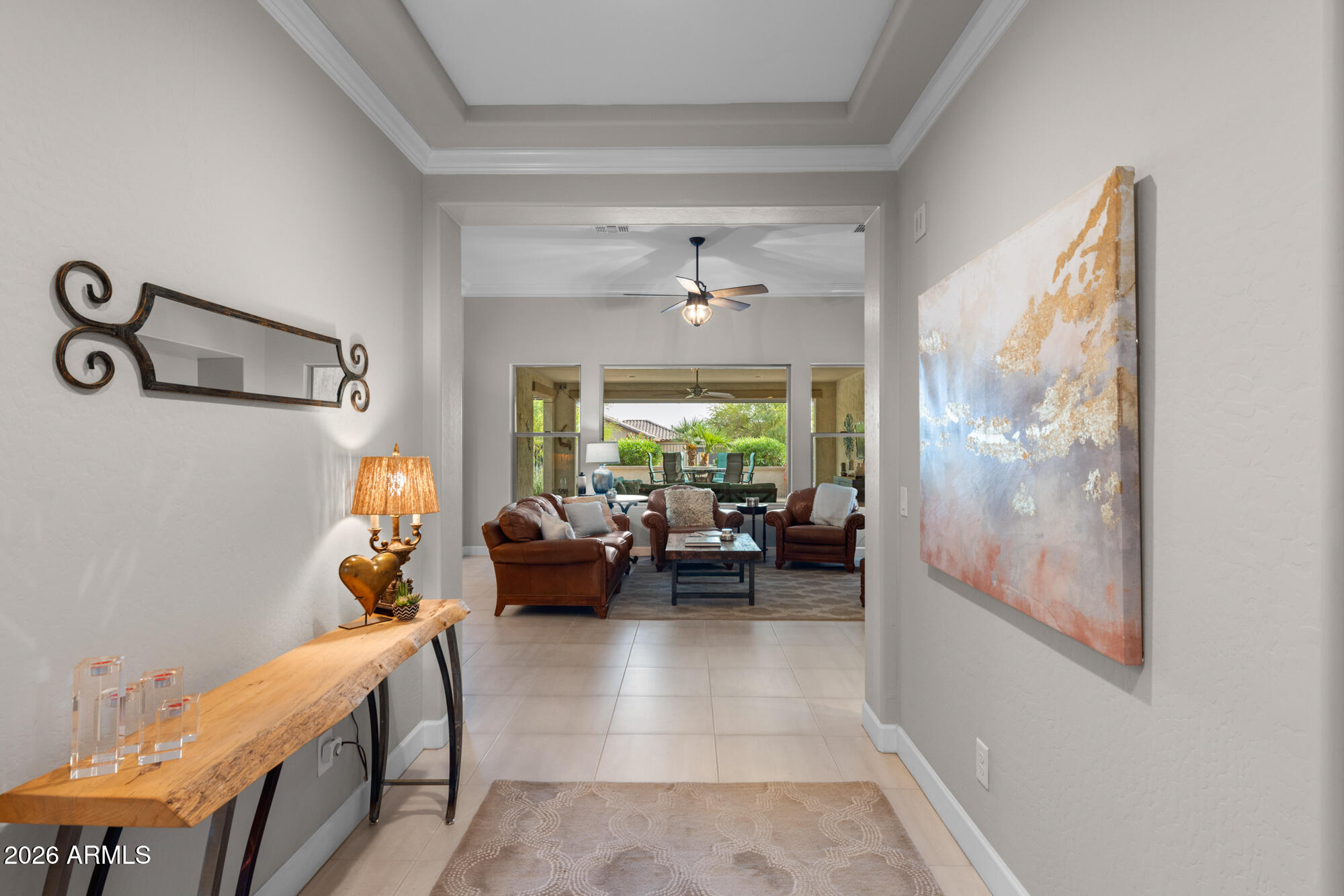 16705 Virginia Avenue Goodyear, AZ 85395 - Photo 5 of 56 a living room with furniture and a large window