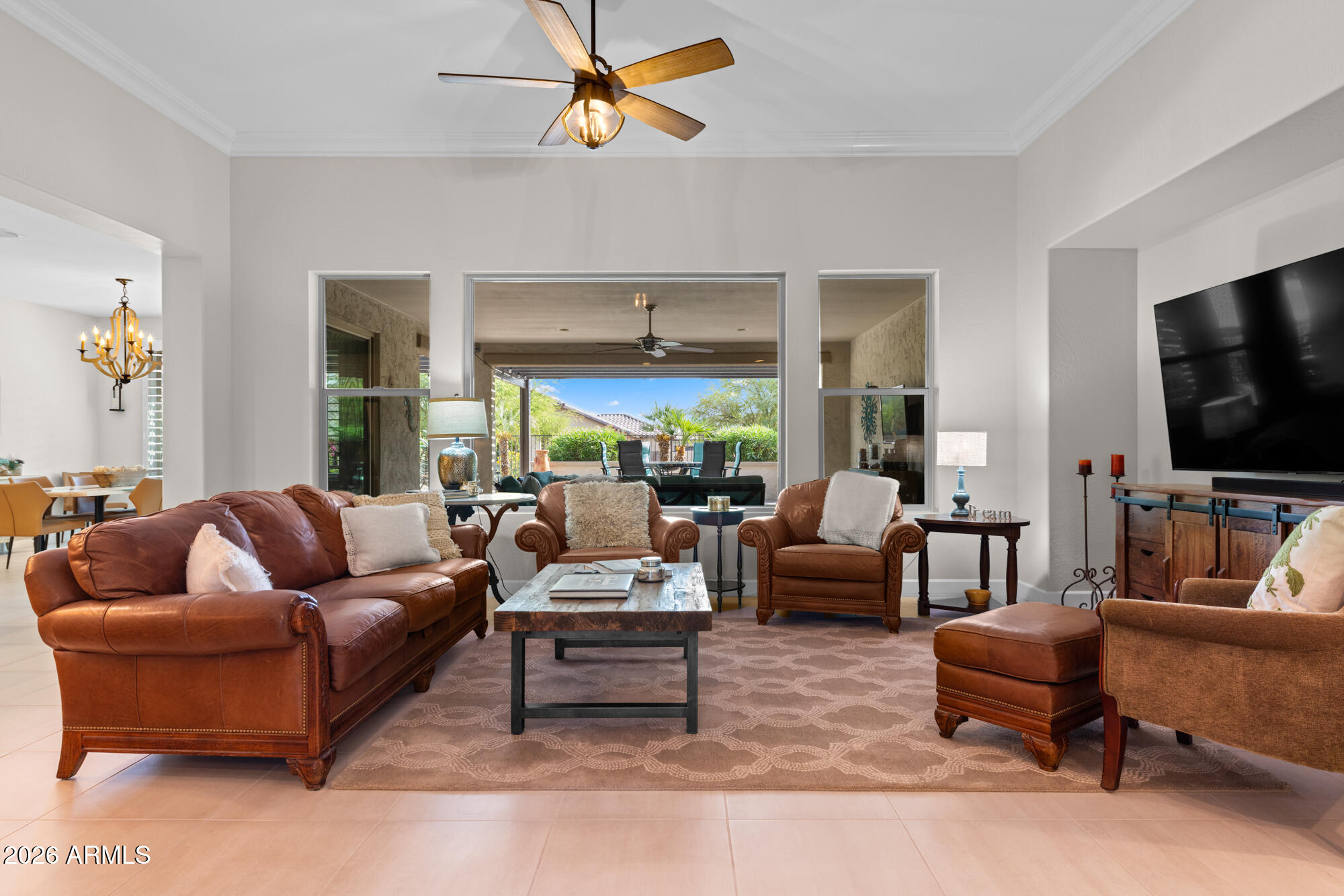 16705 Virginia Avenue Goodyear, AZ 85395 - Photo 6 of 56 a living room with furniture and a flat screen tv