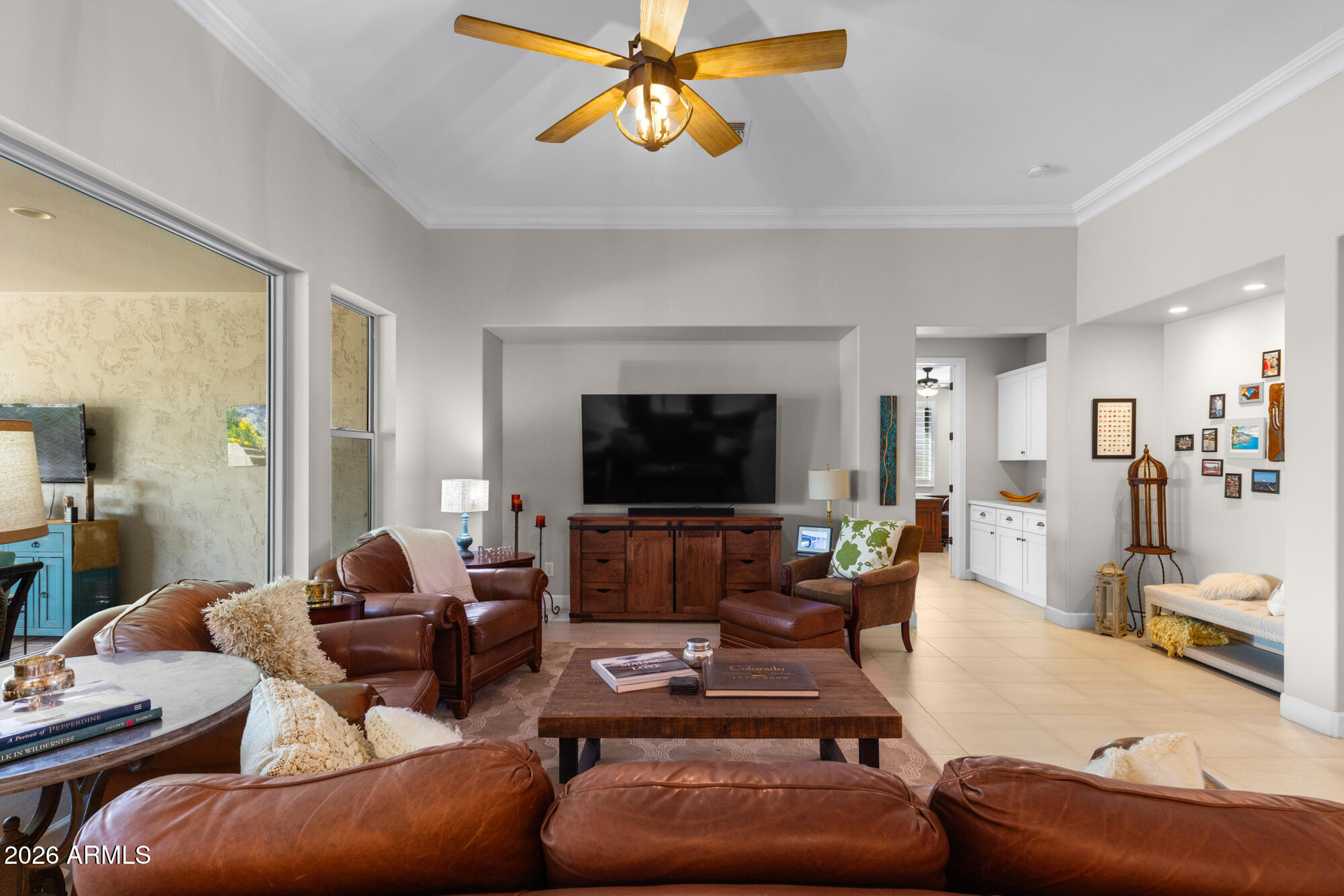 16705 Virginia Avenue Goodyear, AZ 85395 - Photo 7 of 56 a living room with furniture and a flat screen tv