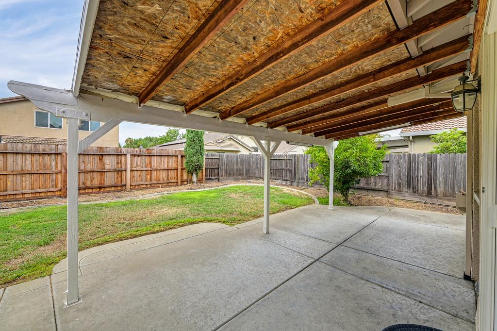 3524 Riojo Way Rancho Cordova, CA 95670 - Photo 41 of 47 a view of a backyard with wooden fence