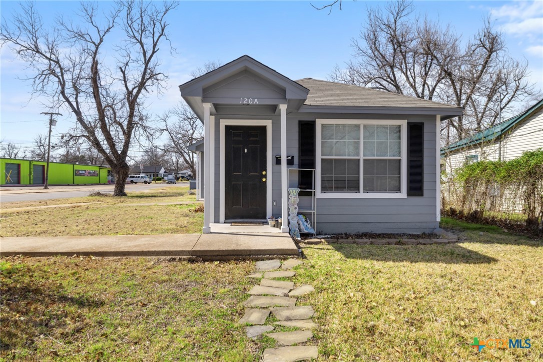 120 South 23rd Street Temple, TX 76504 - Photo 2 of 12 a front view of a house with a yard