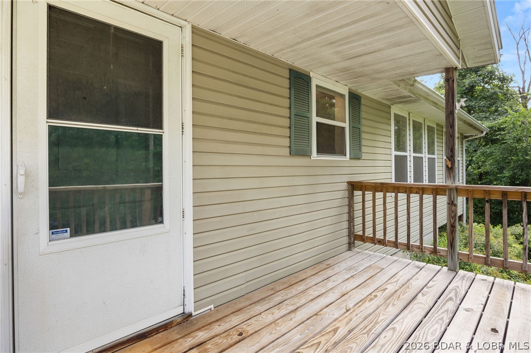 122 Hicks Drive Eldon, MO 65026 - Photo 4 of 51 Partially covered front deck