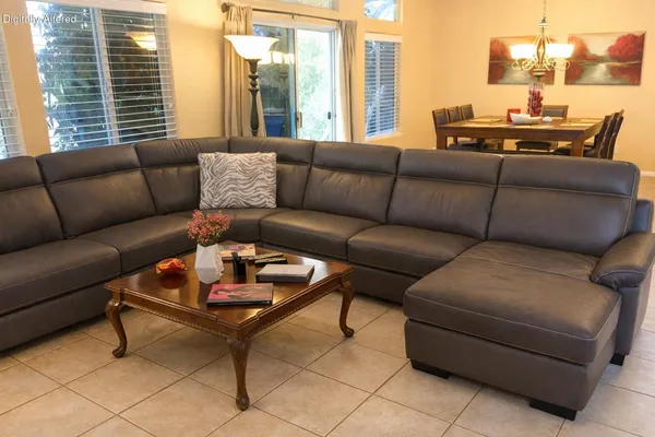a living room with furniture and a large window