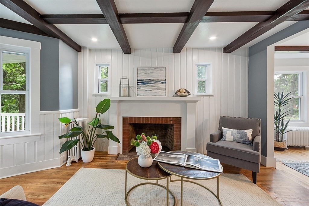 136 Groton Road North Chelmsford, MA 01863 - Photo 12 of 41 a living room with furniture and a fireplace