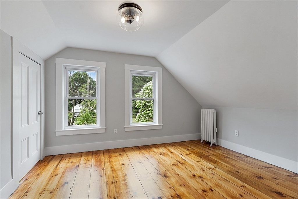 136 Groton Road North Chelmsford, MA 01863 - Photo 33 of 41 an empty room with wooden floor and windows