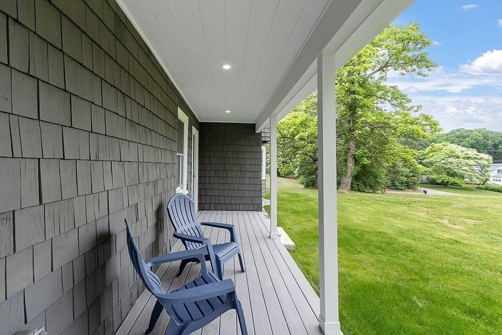 136 Groton Road North Chelmsford, MA 01863 - Photo 8 of 41 a view of chair and table in patio with wooden fence