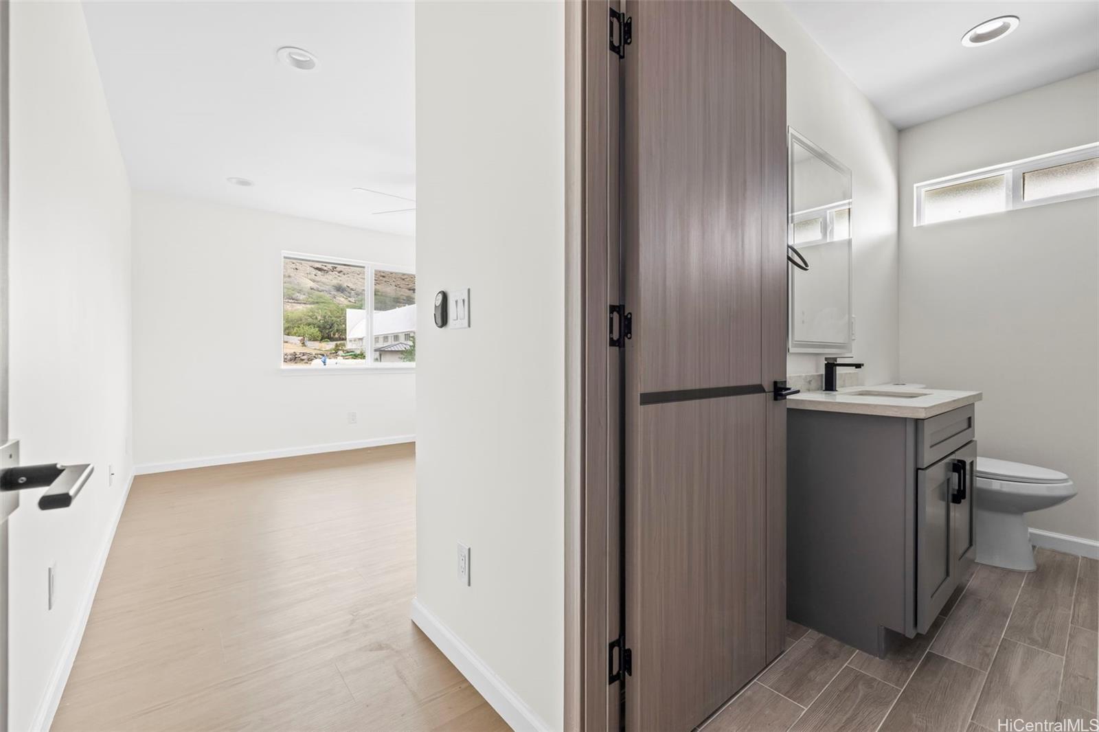87-1474 Akowai Road, Unit A Waianae, HI 96792 - Photo 14 of 25 a bathroom with a sink and a mirror