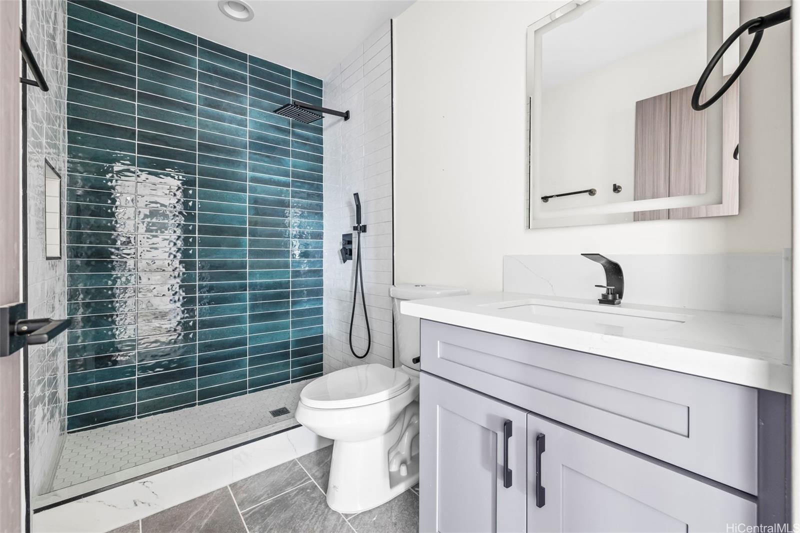 87-1474 Akowai Road, Unit A Waianae, HI 96792 - Photo 10 of 25 a bathroom with a sink toilet and shower