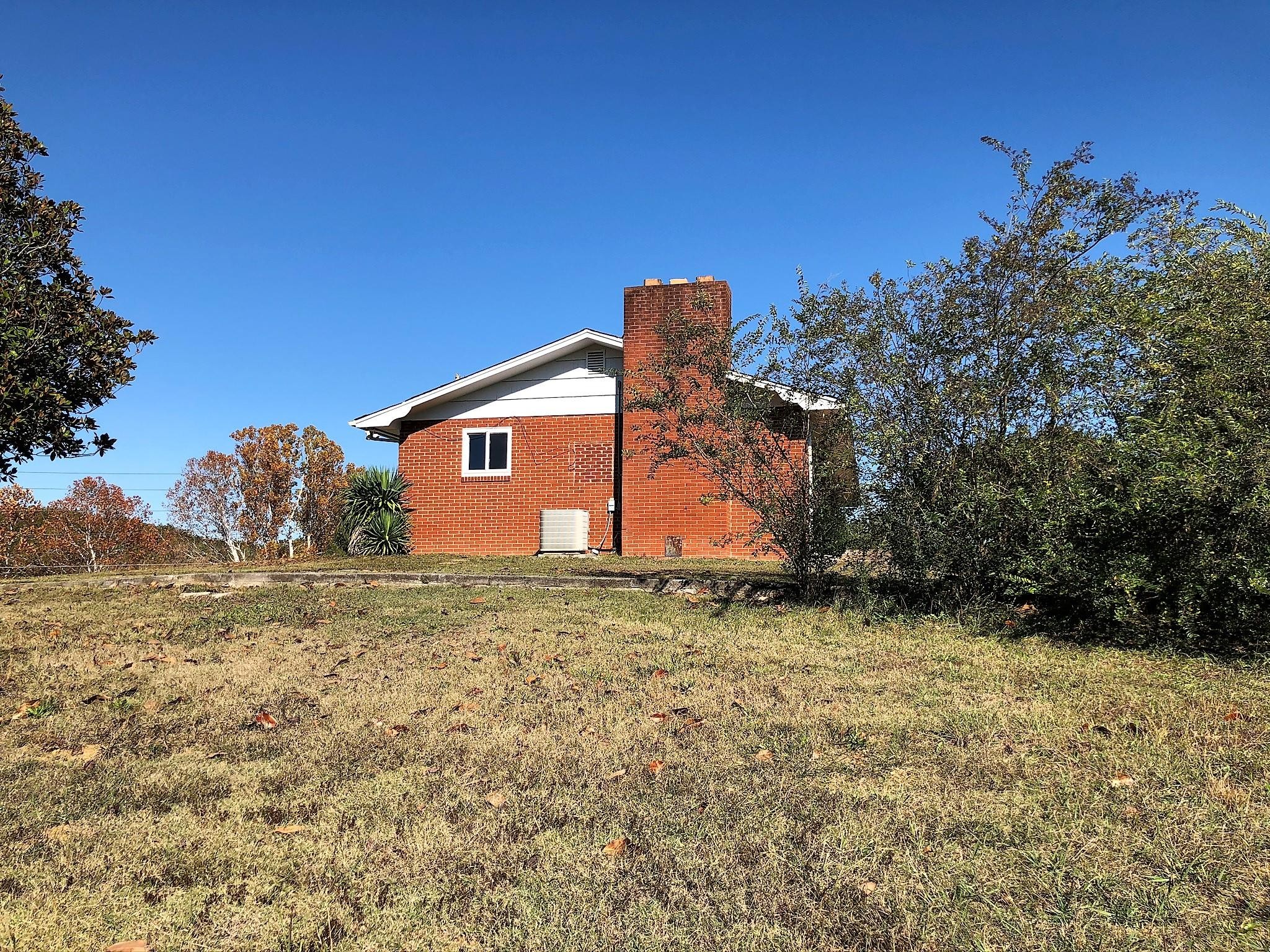 815 Lohman Road Sevierville, TN 37876 - Photo 13 of 14 a big room with lots of trees