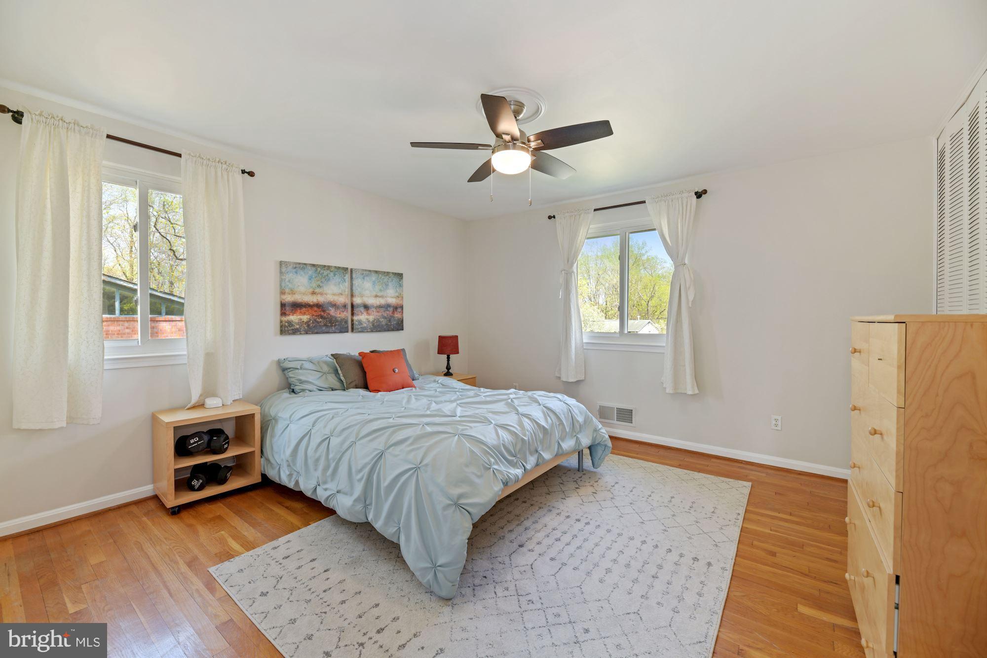 5228 Perth Court Springfield, VA 22151 - Photo 15 of 26 a bedroom with a bed dresser and a window