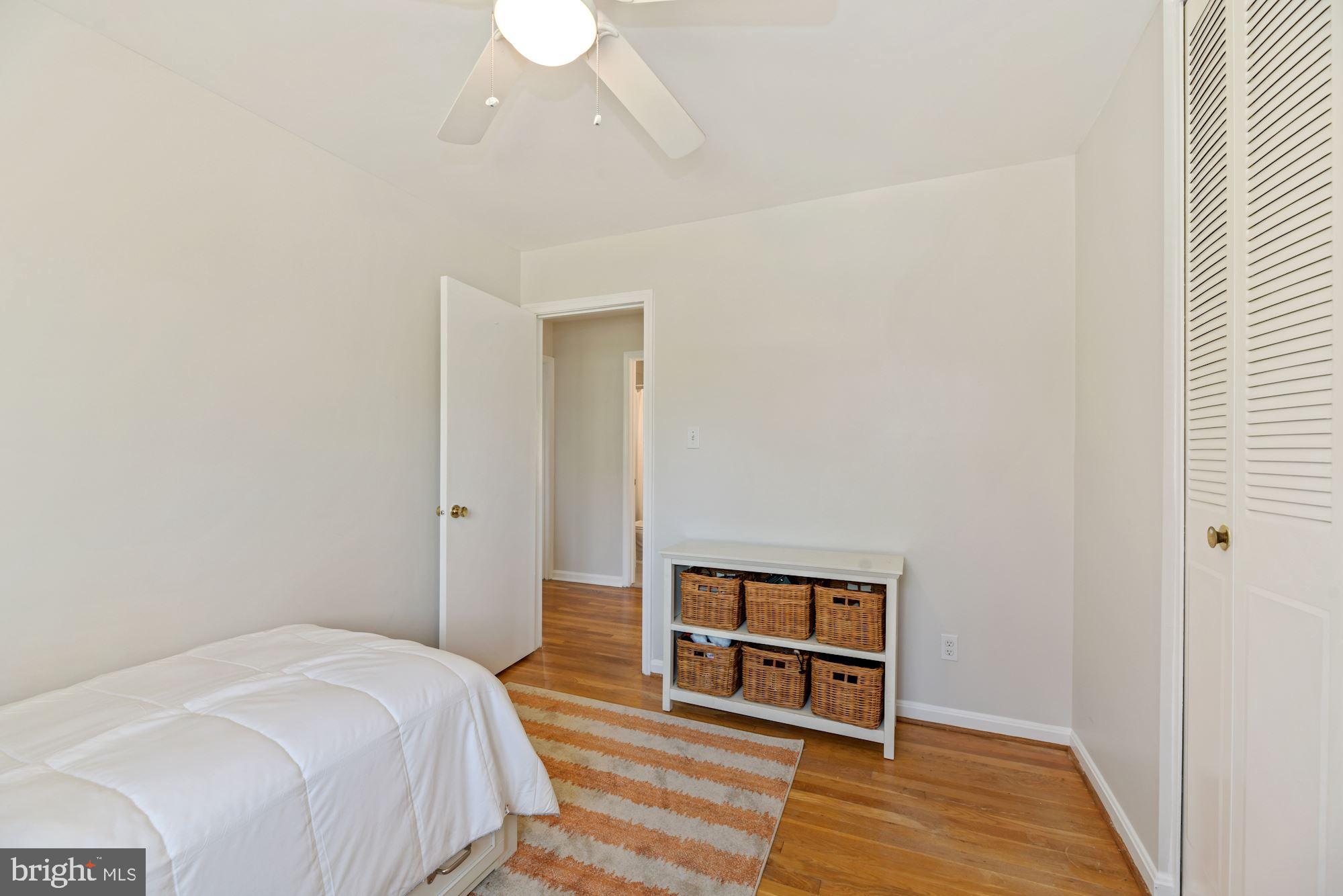 5228 Perth Court Springfield, VA 22151 - Photo 20 of 26 a bedroom with a bed and a mirror