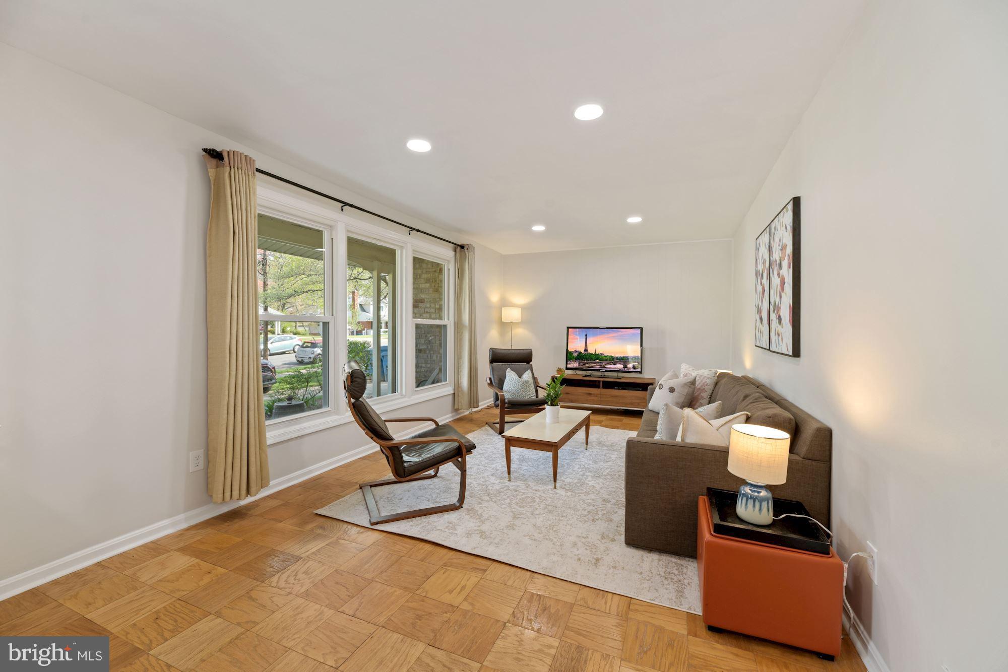 5228 Perth Court Springfield, VA 22151 - Photo 3 of 26 a living room with furniture a window and a flat screen tv