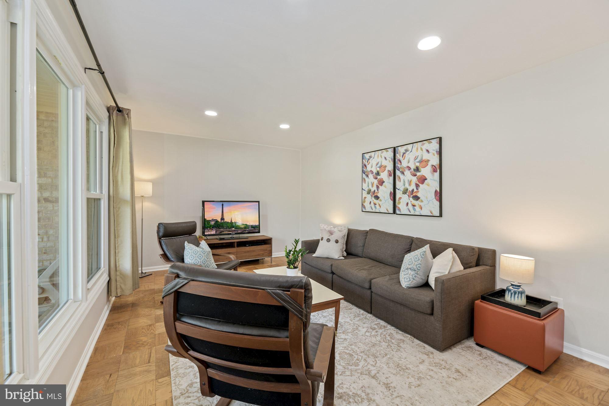 5228 Perth Court Springfield, VA 22151 - Photo 4 of 26 a living room with furniture and a flat screen tv