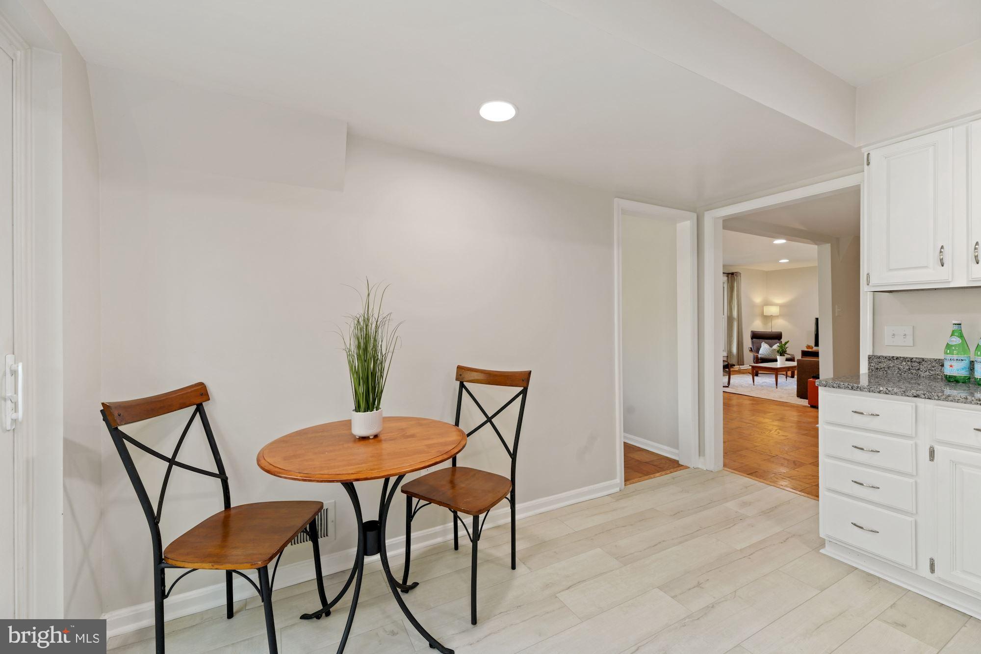 5228 Perth Court Springfield, VA 22151 - Photo 10 of 26 a view of a dining room with furniture and wooden floor